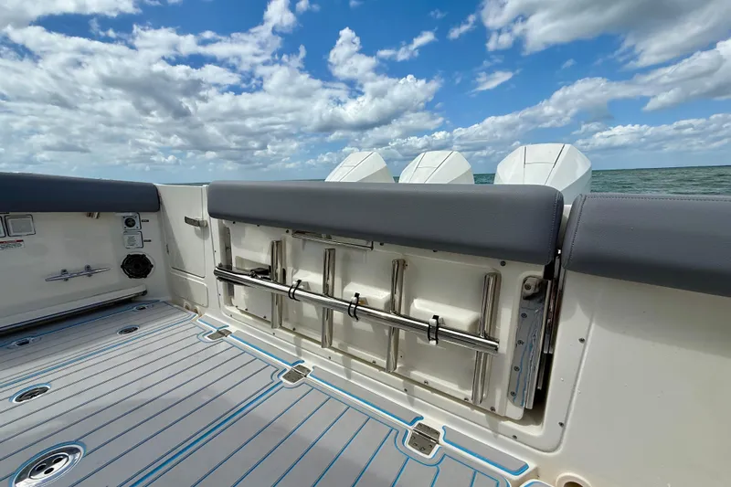Slide: The Image of 2025 Boston Whaler 350 Realm boat interior with ocean view and triple engines. - 15