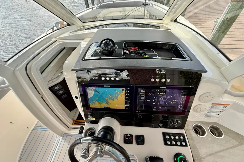 Slide: The Image of 2025 Boston Whaler 350 Realm helm with advanced navigation and control systems. - 40