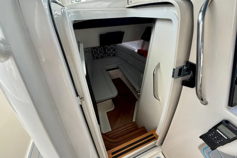 Slide: The Image of Interior cabin view of 2025 Boston Whaler 350 Realm, featuring sleek seating and modern design. - 48