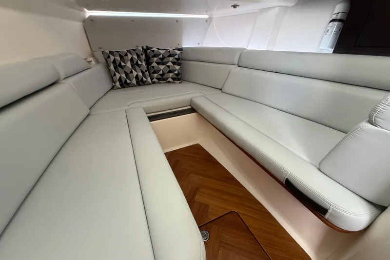 Slide: The Image of Luxurious interior seating of 2025 Boston Whaler 350 Realm with geometric cushions. - 50