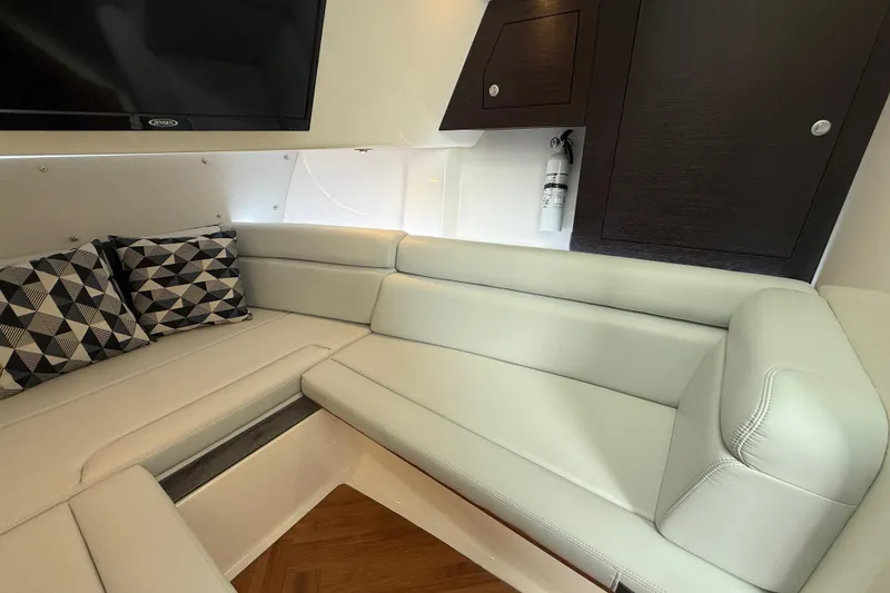Slide: The Image of Luxurious interior of 2025 Boston Whaler 350 Realm with plush seating and modern decor. - 51