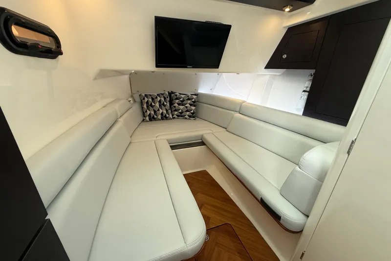 Slide: The Image of Luxurious interior of 2025 Boston Whaler 350 Realm with plush seating and modern amenities. - 52