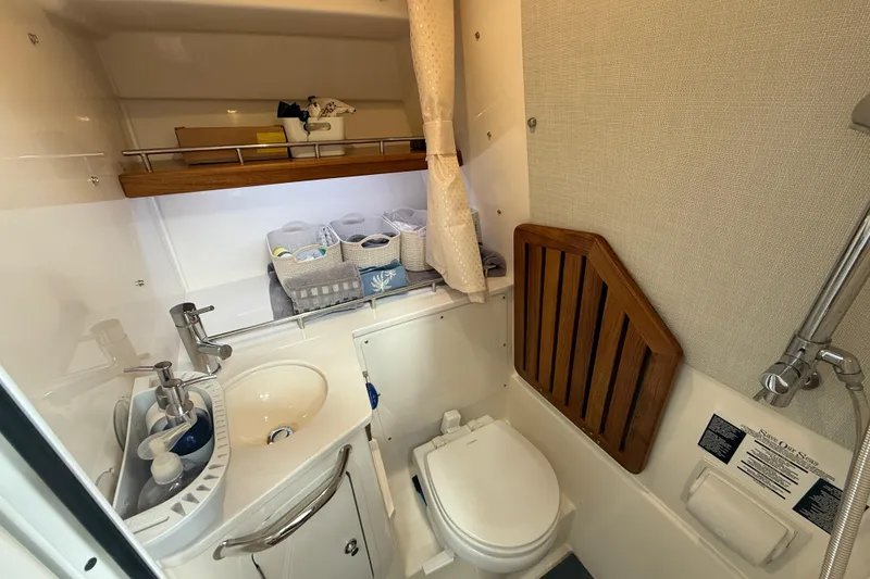 Slide: The Image of Luxurious bathroom interior of 2025 Boston Whaler 350 Realm boat, featuring modern amenities. - 53