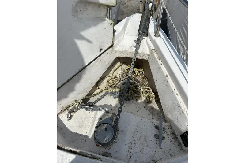 Slide: The Image of Anchor chain and rope on 2014 Hunter e33 sailboat deck. - 11