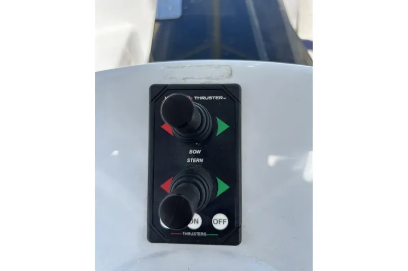 Slide: The Image of Control panel of a 2014 Hunter e33 boat with bow and stern thruster controls. - 12