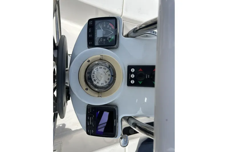 Slide: The Image of 2014 Hunter e33 yacht helm with compass and navigation instruments. - 14