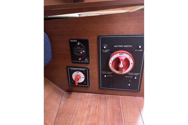 Slide: The Image of Control panel of a 2014 Hunter e33 sailboat with battery and engine starter switches. - 19