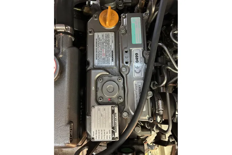 Slide: The Image of Close-up of a 2014 Hunter e33 engine with visible Yanmar branding and components. - 21