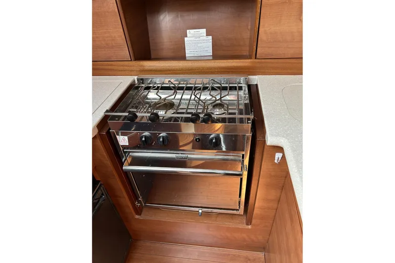 Slide: The Image of 2014 Hunter e33 yacht kitchen with stainless steel stove and oven. - 28