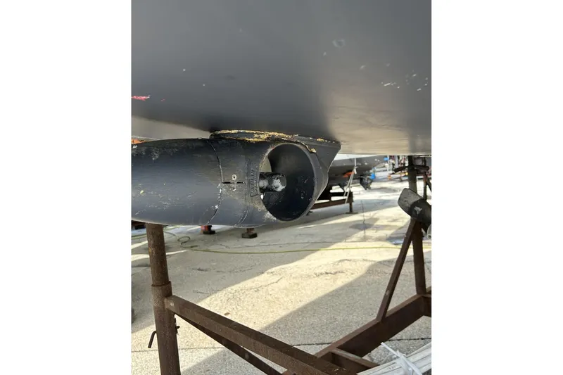 Slide: The Image of 2014 Hunter e33 sailboat propeller and hull detail in dry dock. - 4