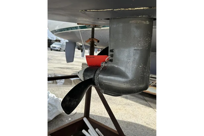 Slide: The Image of Close-up of a 2014 Hunter e33 sailboat propeller and rudder on a stand. - 5