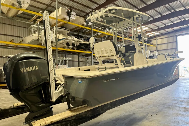Slide: The Image of 2022 Tidewater 2300 Carolina Bay boat with Yamaha engine in storage facility. - 1