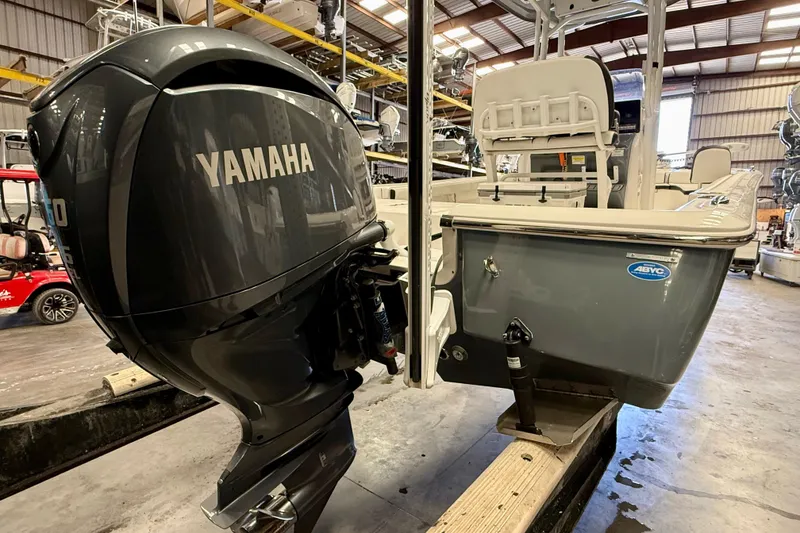 Slide: The Image of 2022 Tidewater 2300 Carolina Bay boat with Yamaha outboard motor in a warehouse. - 11