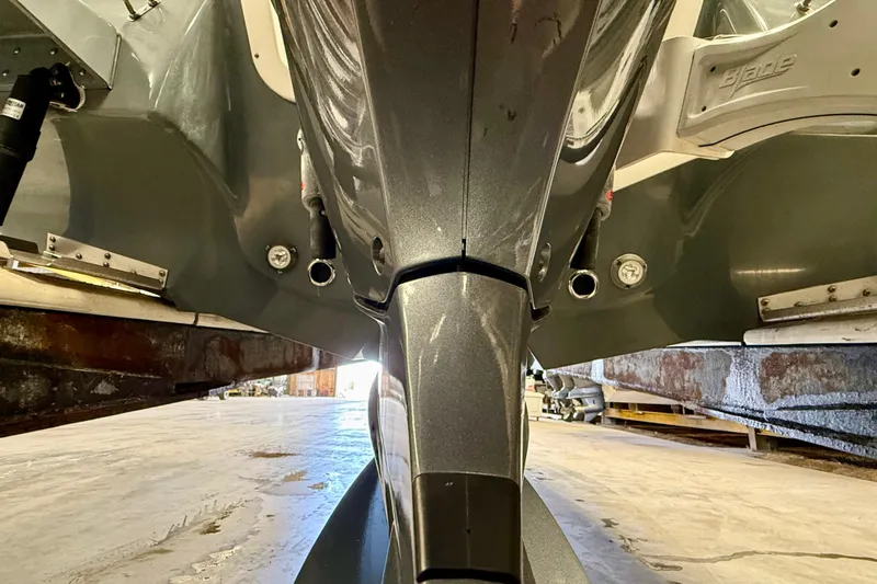 Slide: The Image of 2022 Tidewater 2300 Carolina Bay boat hull and motor detail in a workshop. - 13