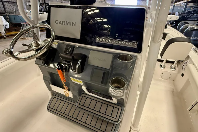 Slide: The Image of 2022 Tidewater 2300 Carolina Bay boat console with Garmin display and Yamaha controls. - 14