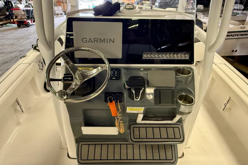 Slide: The Image of Center console of 2022 Tidewater 2300 Carolina Bay boat with Garmin navigation system. - 15
