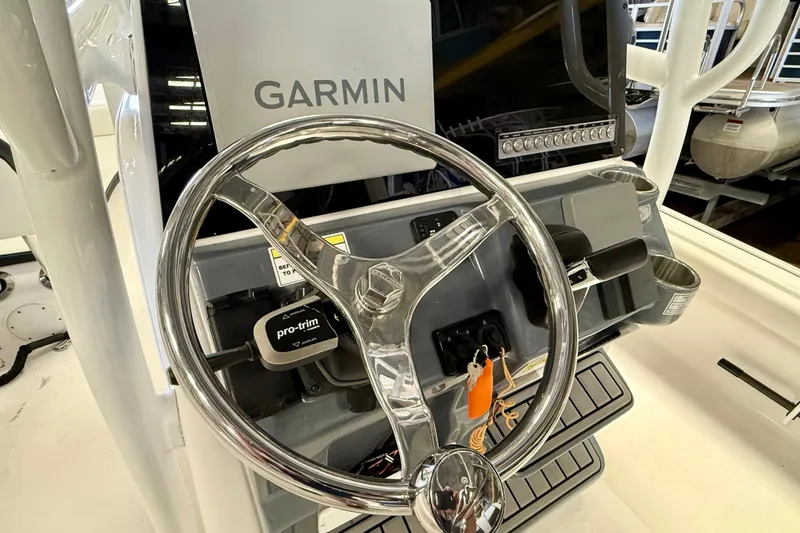 Slide: The Image of Steering console of 2022 Tidewater 2300 Carolina Bay boat with Garmin navigation system. - 16