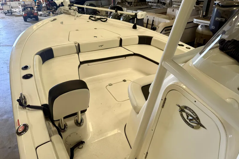 Slide: The Image of 2022 Tidewater 2300 Carolina Bay boat interior with seating and storage compartments. - 17