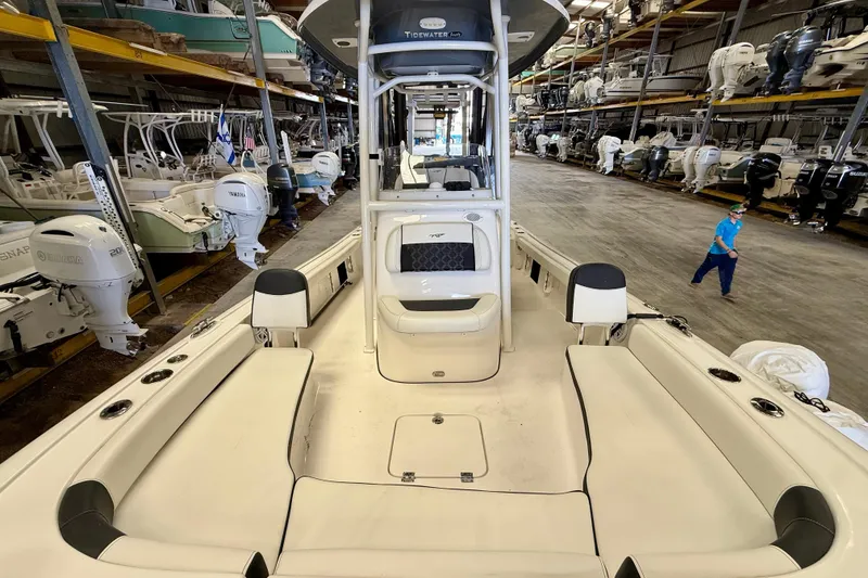 Slide: The Image of 2022 Tidewater 2300 Carolina Bay boat in storage, showcasing spacious seating and modern design. - 18