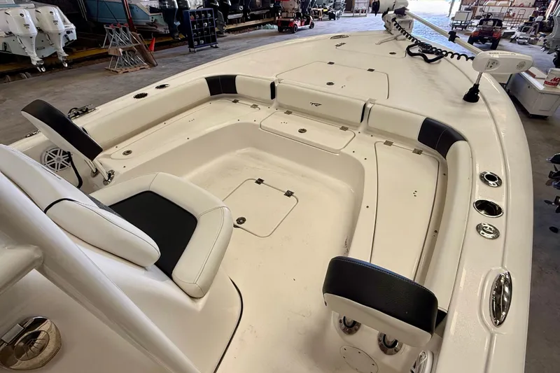 Slide: The Image of 2022 Tidewater 2300 Carolina Bay boat interior with seating and storage compartments. - 19