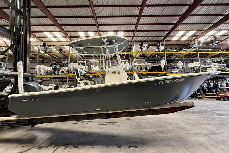 Slide: The Image of 2022 Tidewater 2300 Carolina Bay boat in storage facility, side view. - 2