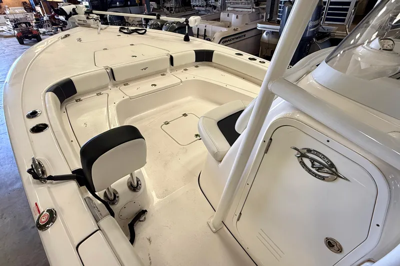 Slide: The Image of 2022 Tidewater 2300 Carolina Bay boat interior with seating and storage compartments. - 20