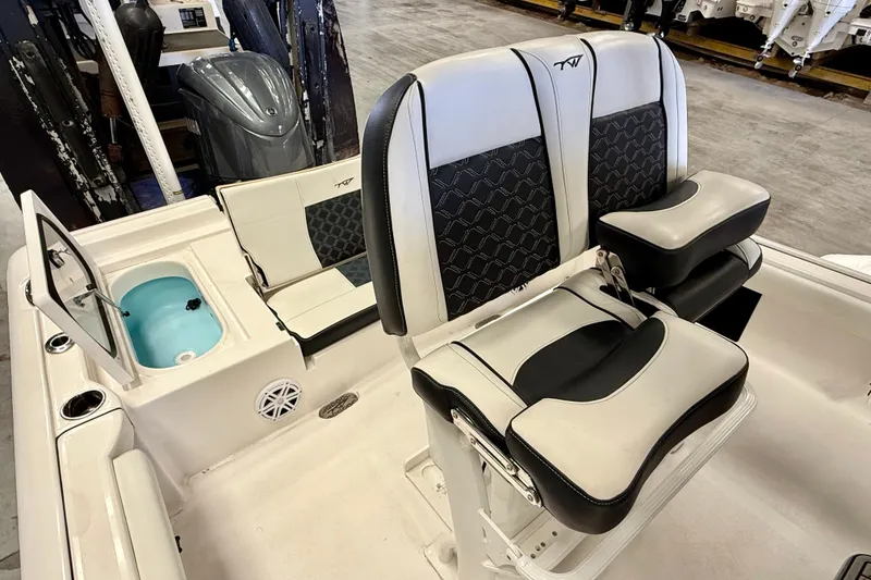 Slide: The Image of 2022 Tidewater 2300 Carolina Bay boat interior with seating and storage compartments. - 24
