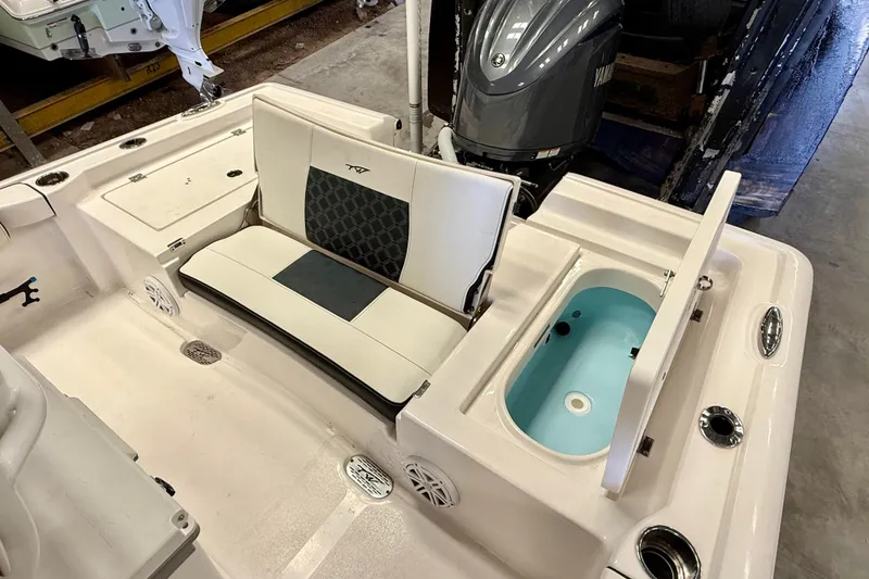 Slide: The Image of 2022 Tidewater 2300 Carolina Bay boat interior with seating and storage compartments. - 26