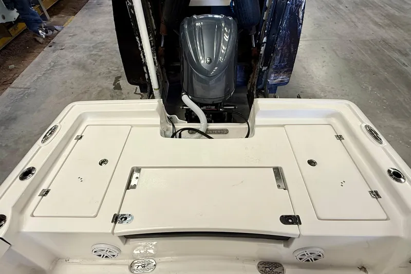 Slide: The Image of 2022 Tidewater 2300 Carolina Bay boat with outboard motor, viewed from the rear deck. - 27