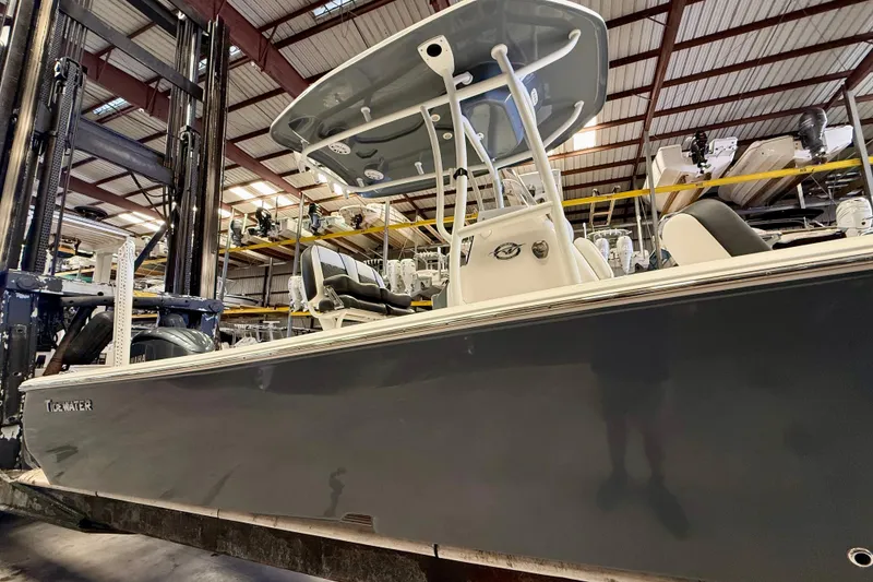 Slide: The Image of 2022 Tidewater 2300 Carolina Bay boat in a storage facility, showcasing sleek design and modern features. - 9