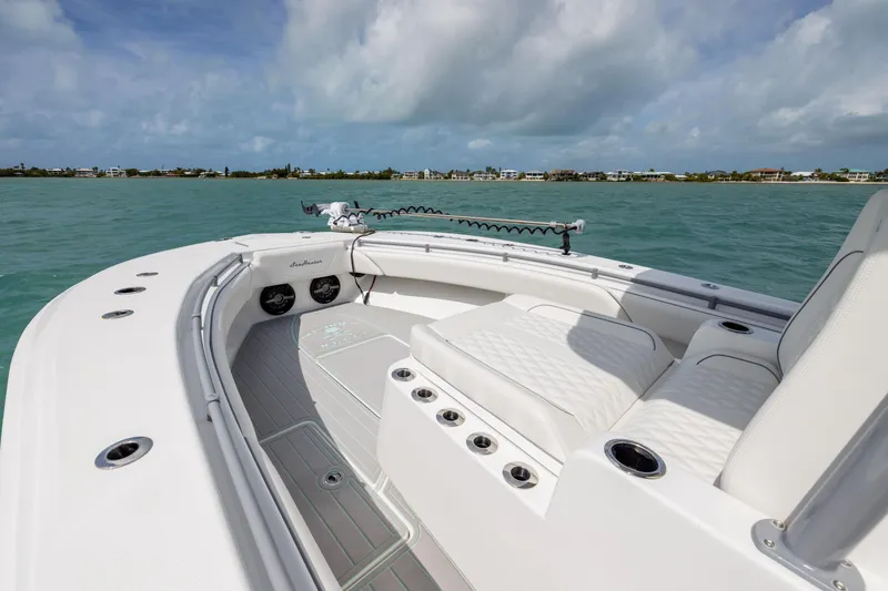 Slide: The Image of 2025 SeaHunter 30 Floridian boat on calm waters under a cloudy sky. - 10