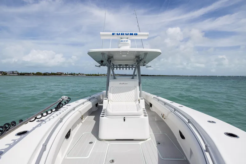Slide: The Image of 2025 SeaHunter 30 Floridian boat on open water under a clear blue sky. - 15