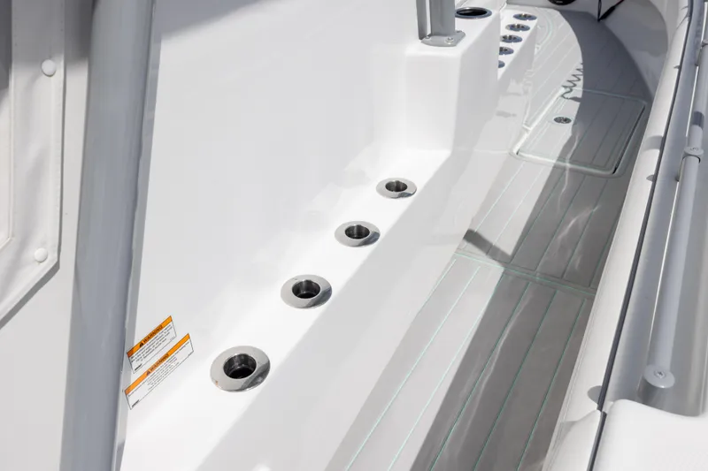 Slide: The Image of 2025 SeaHunter 30 Floridian boat deck with rod holders and non-slip flooring. - 20