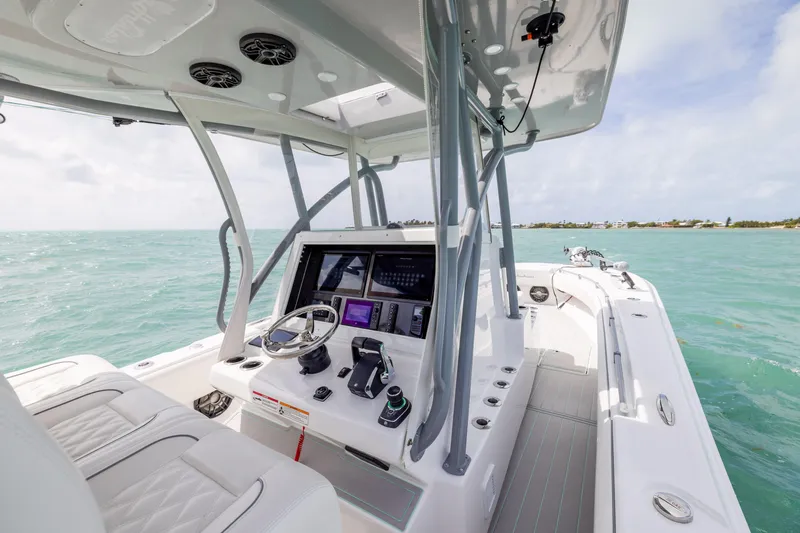 Slide: The Image of Interior view of 2025 SeaHunter 30 Floridian boat on turquoise water. - 26