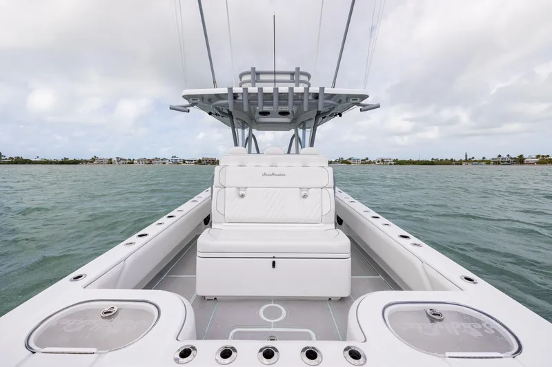 Slide: The Image of 2025 SeaHunter 30 Floridian boat on water, showcasing sleek design and spacious seating. - 29