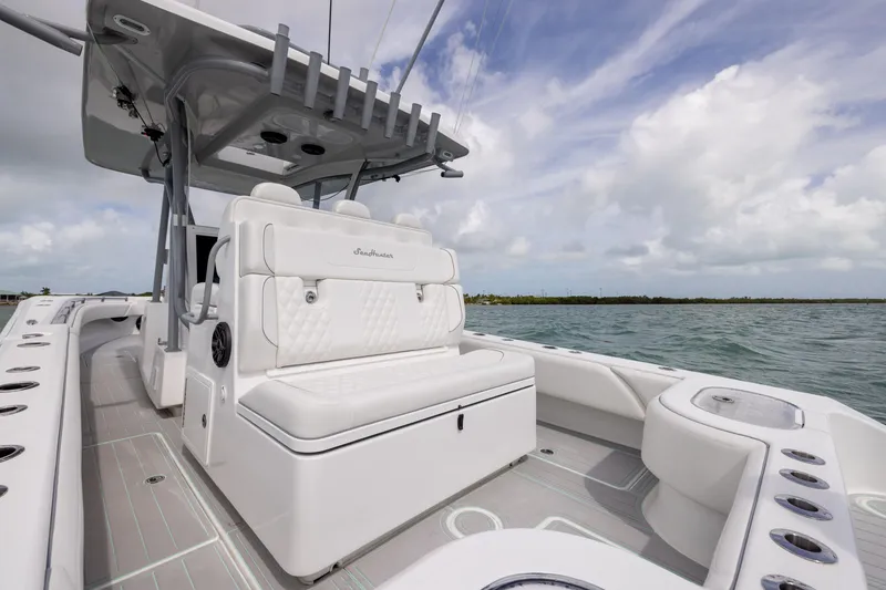 Slide: The Image of 2025 SeaHunter 30 Floridian boat interior with luxurious seating on open water. - 30