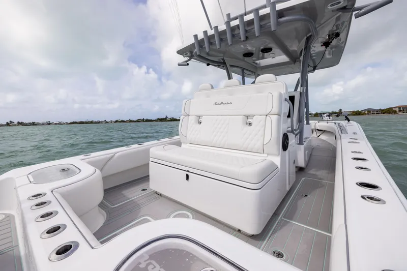 Slide: The Image of 2025 SeaHunter 30 Floridian boat interior with white seating and ocean view. - 31