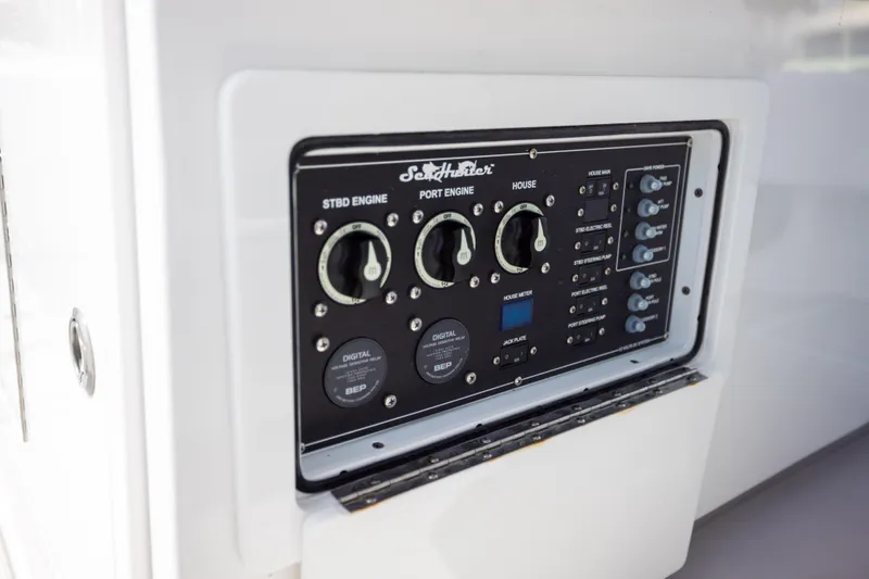 Slide: The Image of Control panel of 2025 SeaHunter 30 Floridian boat, featuring engine and power switches. - 36