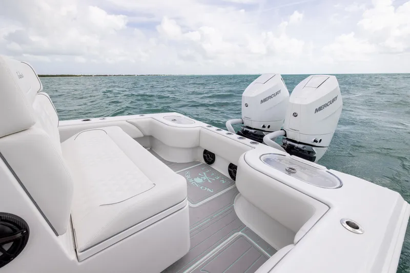 Slide: The Image of 2025 SeaHunter 30 Floridian boat with twin Mercury engines on open water. - 39