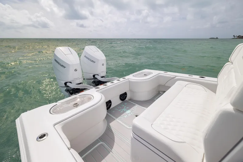 Slide: The Image of 2025 SeaHunter 30 Floridian boat with twin Mercury engines on open water. - 40