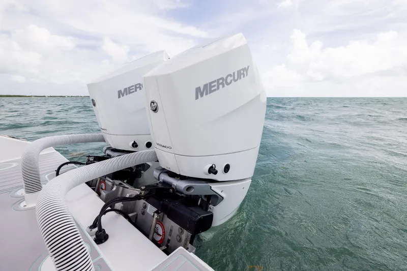 Slide: The Image of Twin Mercury Verado engines on a 2025 SeaHunter 30 Floridian boat in open water. - 41