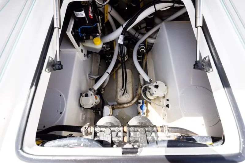 Slide: The Image of Engine compartment of 2025 SeaHunter 30 Floridian boat, showcasing mechanical components and wiring. - 44
