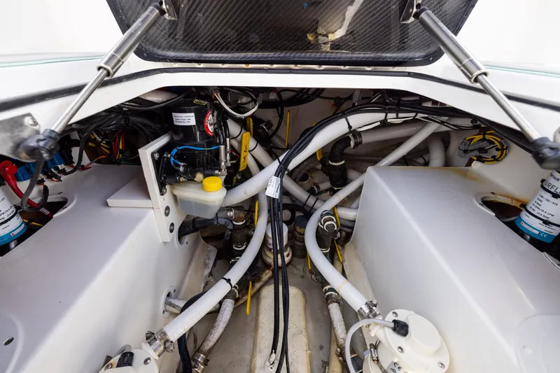 Slide: The Image of Engine compartment of 2025 SeaHunter 30 Floridian boat with visible hoses and components. - 45