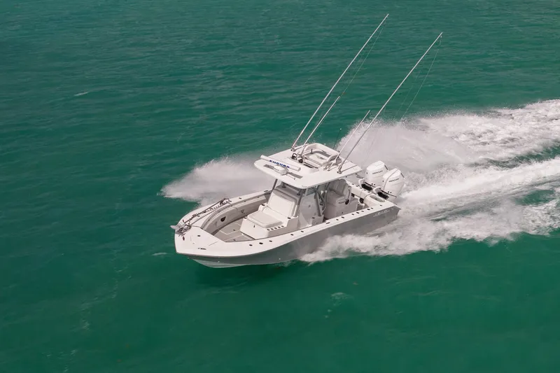 Slide: The Image of 2025 SeaHunter 30 Floridian boat cruising on turquoise waters. - 7