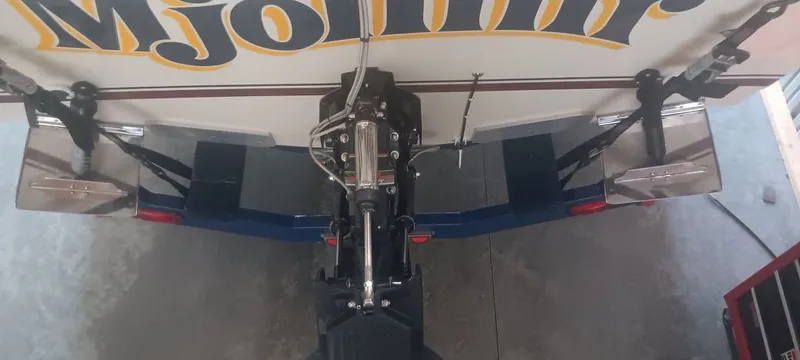 Slide: The Image of Rear view of a 1987 Tiara Yachts Pursuit with motor and lettering. - 12
