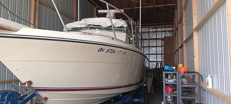 The Image of 1987 Tiara Yachts Pursuit in storage shed, side view. - 2
