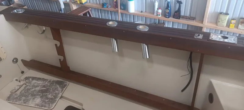 Slide: The Image of Interior view of a 1987 Tiara Yachts Pursuit with wooden details. - 9