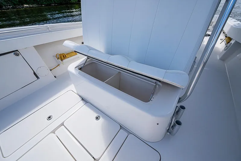 Slide: The Image of 2015 Invincible 42 Open Fisherman boat with open storage compartment and seating. - 10
