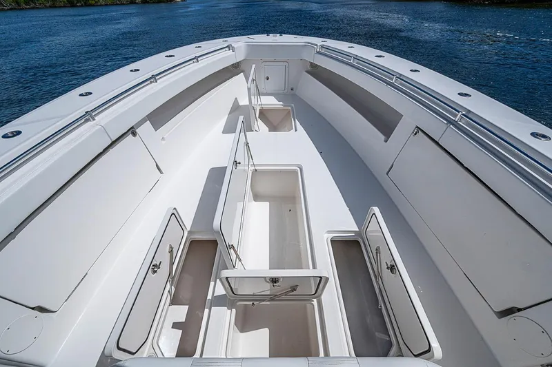 Slide: The Image of 2015 Invincible 42 Open Fisherman boat with open storage compartments on deck. - 6