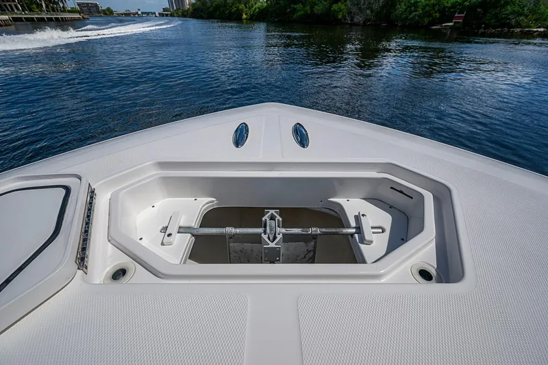 Slide: The Image of Bow view of 2015 Invincible 42 Open Fisherman boat on calm water. - 7